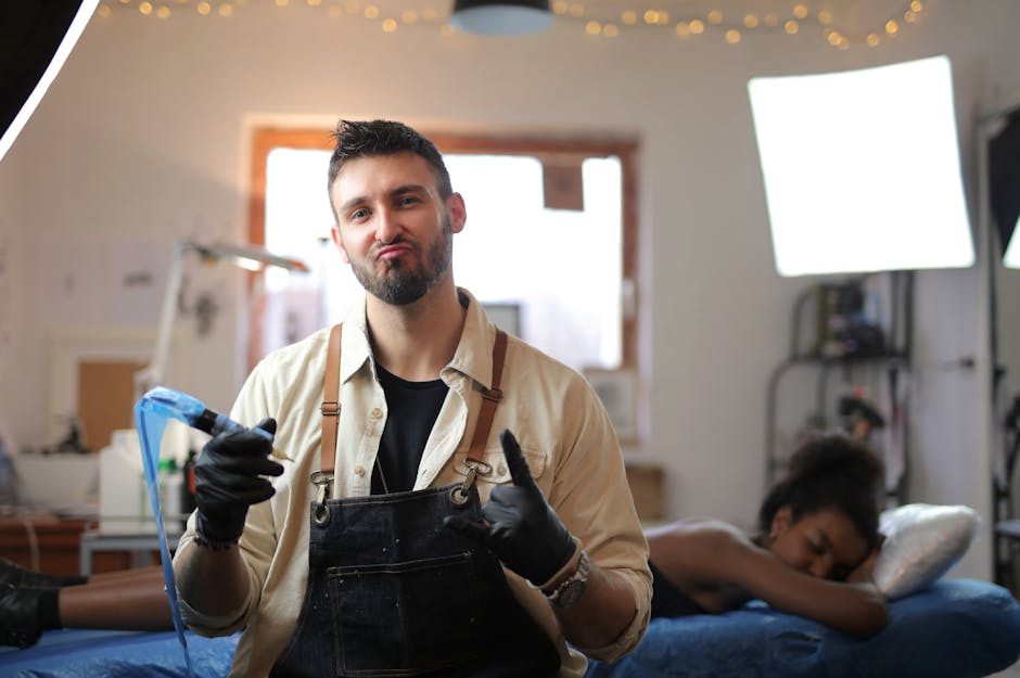 Confident tattoo artist in a studio, preparing to create art on a client.