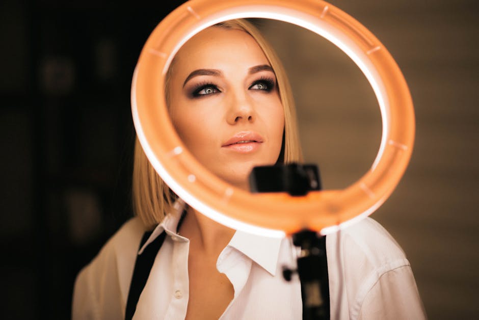 Captivating studio portrait of a fashionable young woman illuminated by a ring light.
